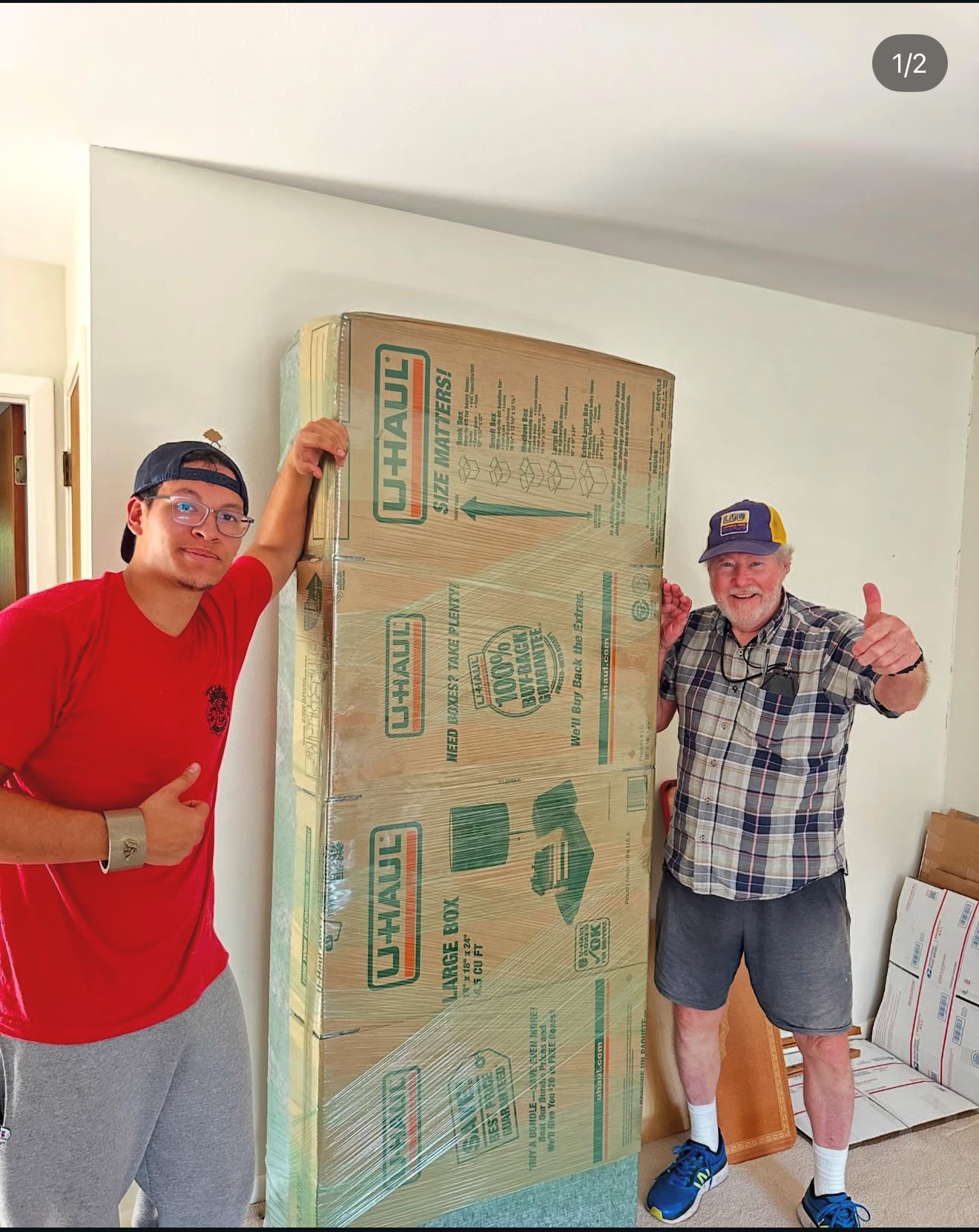 ATX Firefighter Moving crew member helping a client with protected moving boxes