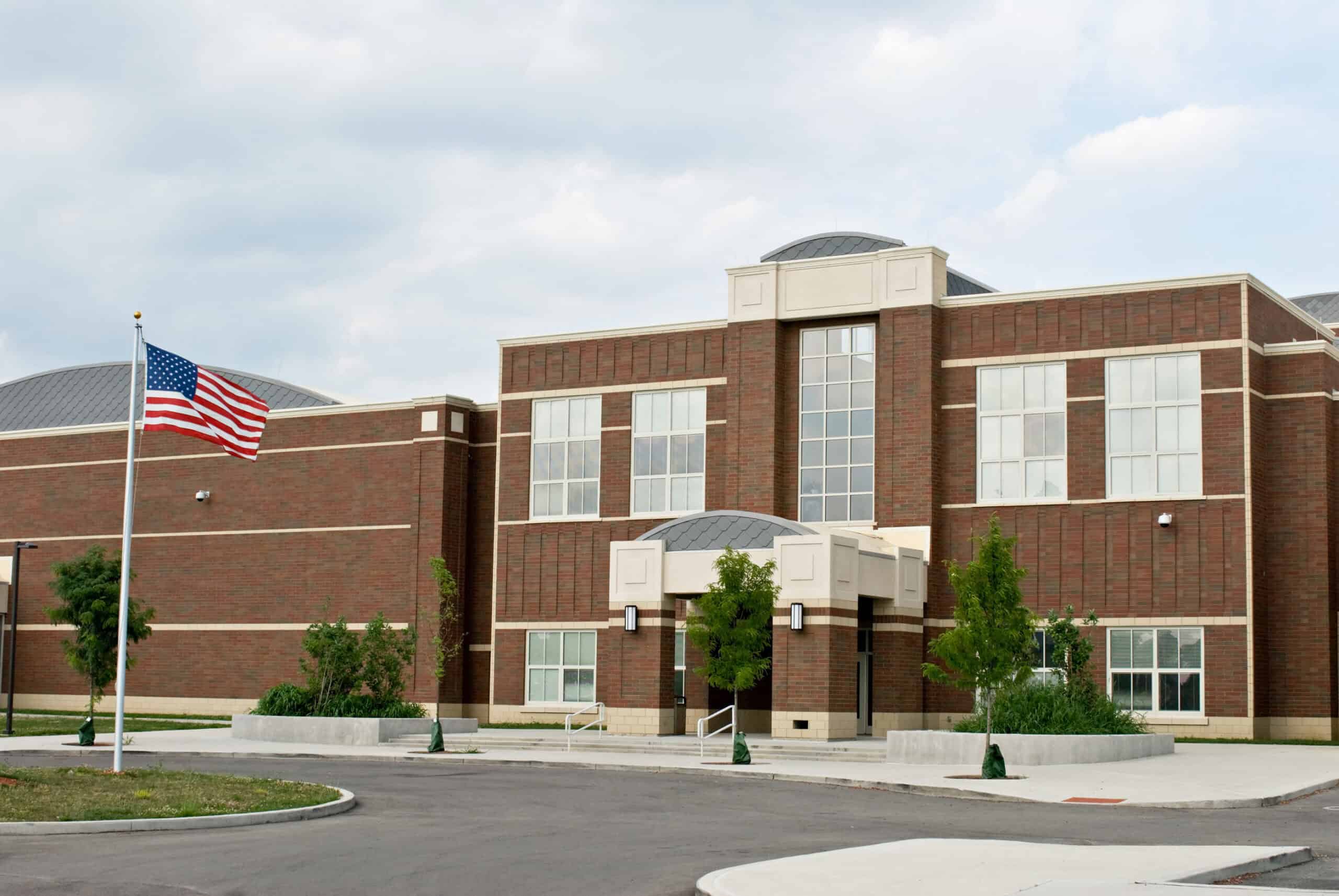 Public school building in Austin TX with American flag