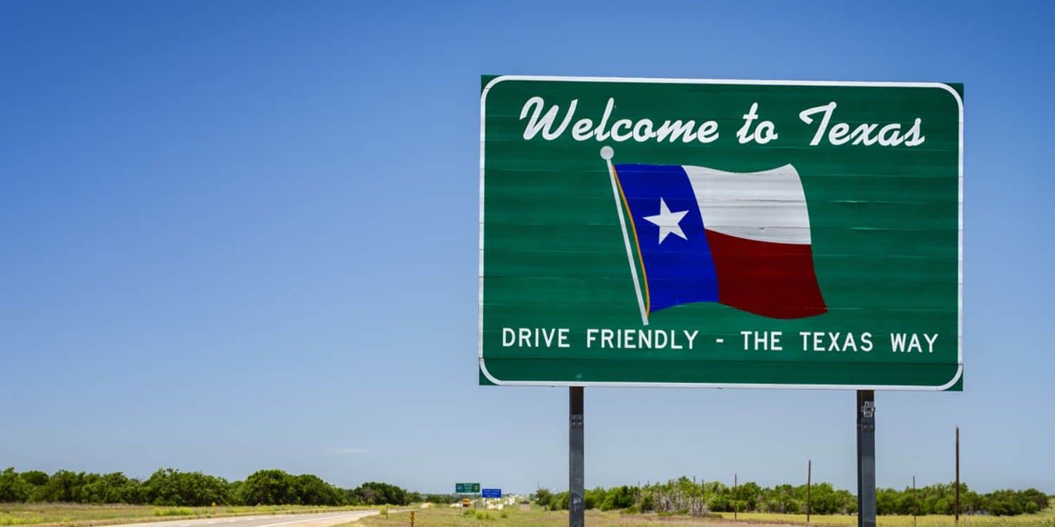 Welcome to Texas road sign representing Texas hospitality